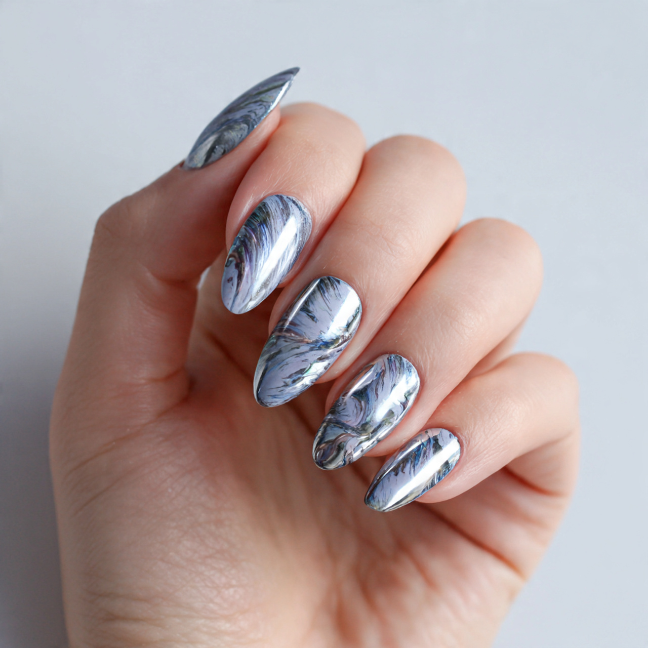 Stunning Silver Chrome Nails for a Futuristic Look 10 Galaxy Silver Swirl